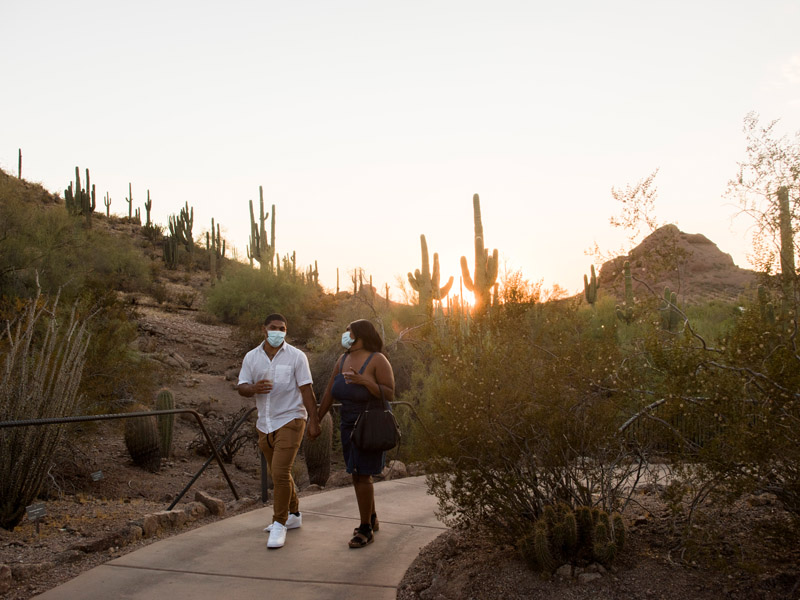 Young couple strolling the trails at sunset